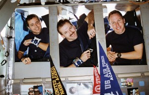 Astronauts Dan Bursch, Steve Smith, and Tom Jones about to sleep on Space Shuttle Endeavour